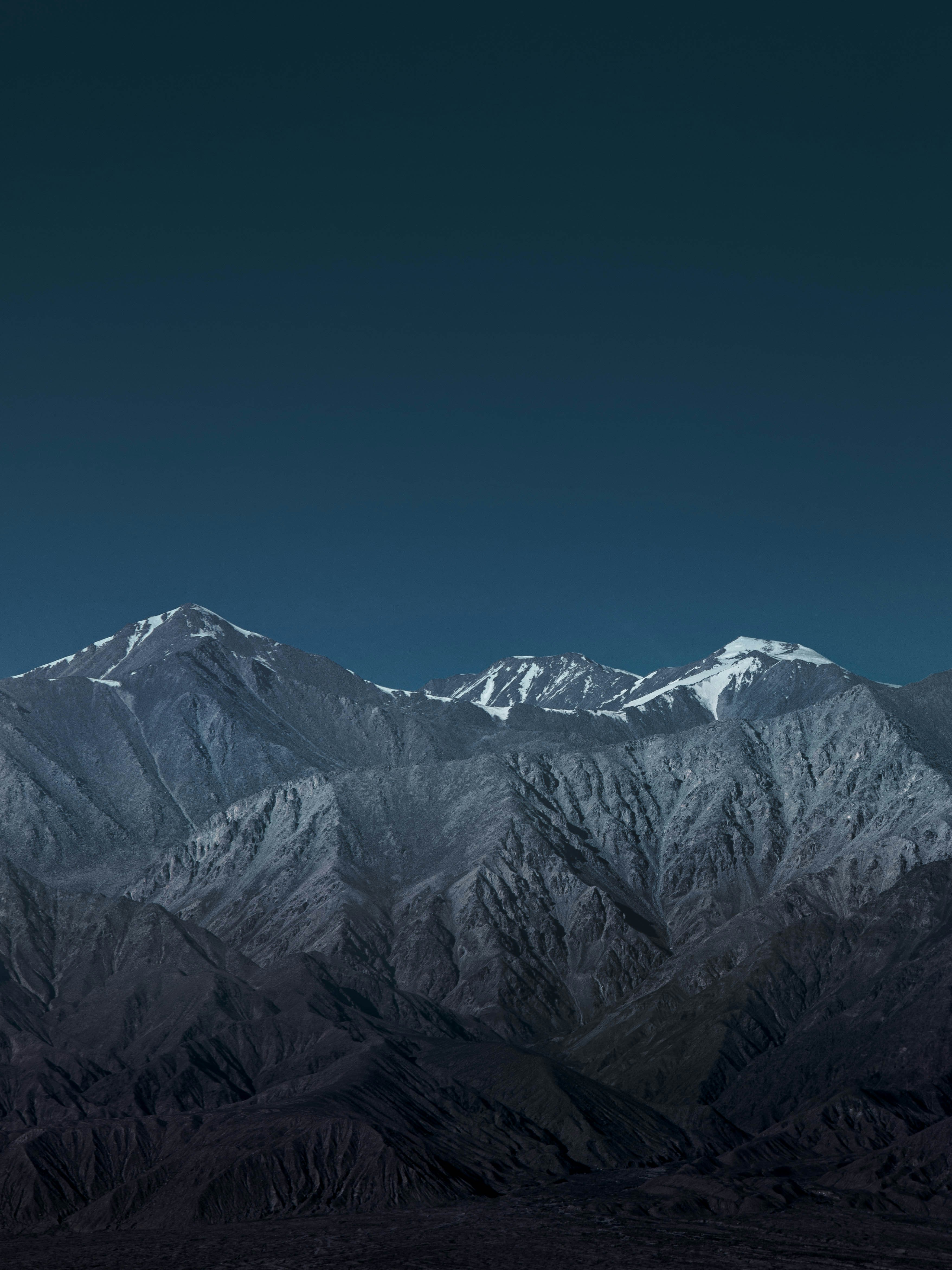 snow covered mountain under blue sky during daytime